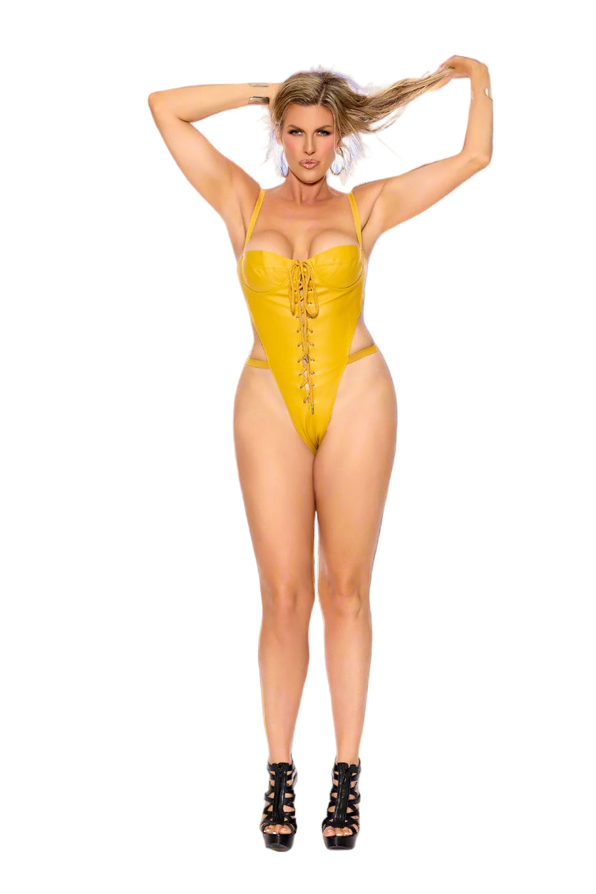 Woman wearing a yellow lace-up leather teddy with underwire cups